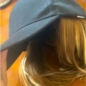 Selling black hat with hair extensions